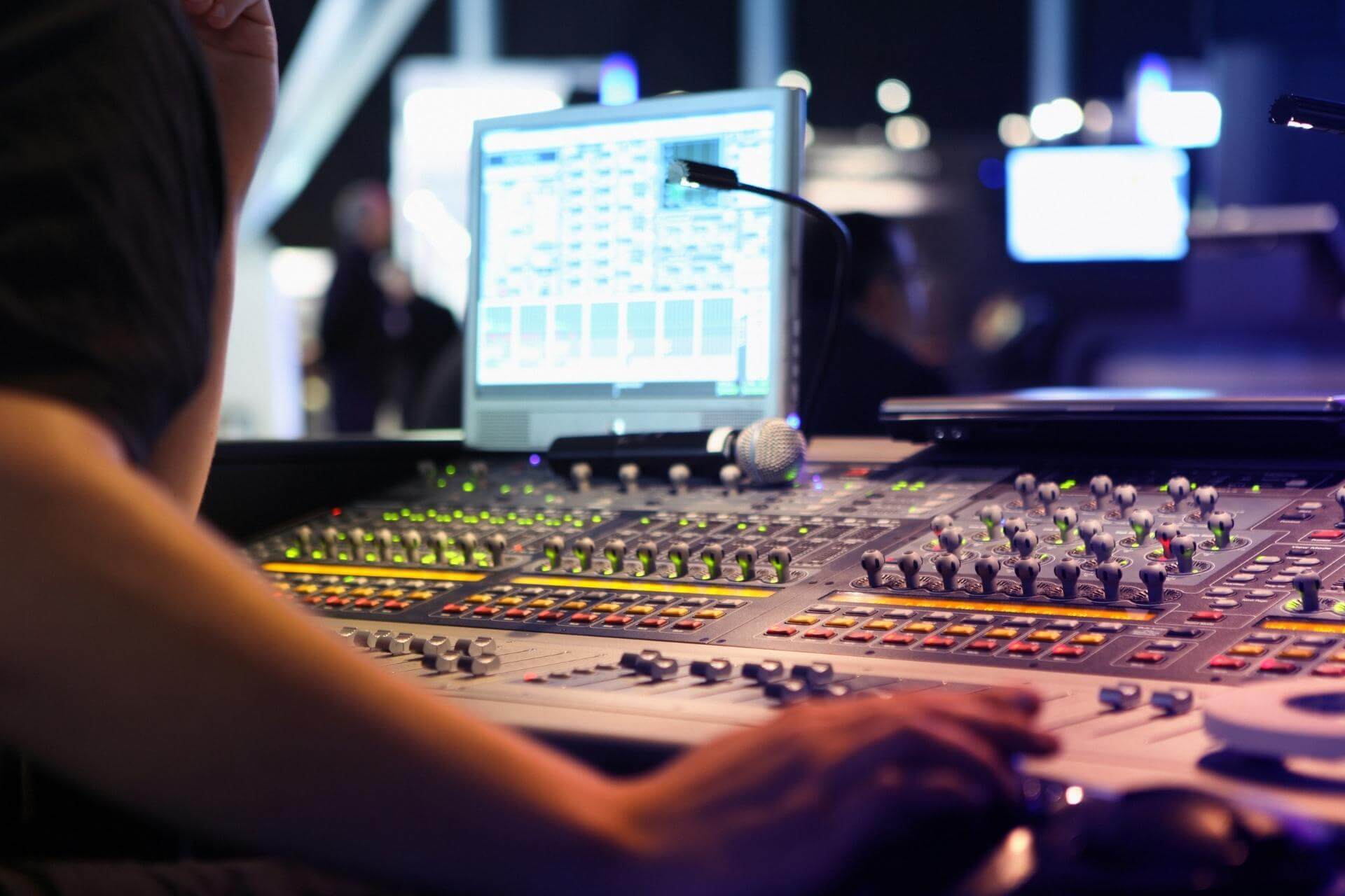 sound technician mixing at a sound board